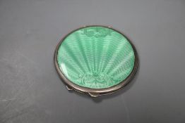 A 1950's silver and green guilloche enamel circular compact, 85mm Birmingham, 1950.