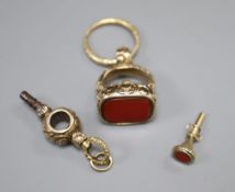 A 19th century yellow metal overlaid fob seal with uncut carnelian matrix, a 19th century yellow