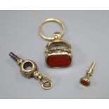 A 19th century yellow metal overlaid fob seal with uncut carnelian matrix, a 19th century yellow