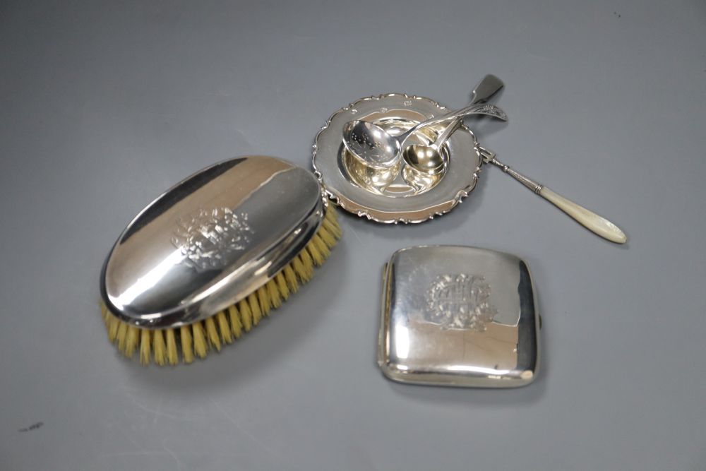 Silver clothes brush, cigarette case, dish, two spoons and white metal dessert fork.