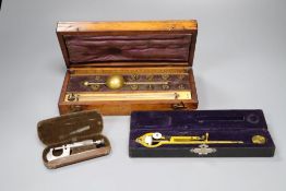 A 19th century brass Polar Planimeter (Amsler short-arm type) by Stanley, with weight and two