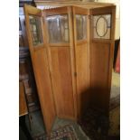 An Edwardian glazed oak four fold dressing screen, each panel 40 x 180cm