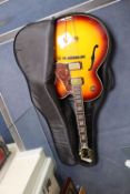 An Aria Career electric acoustic and jazz guitar, in soft case