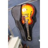 An Aria Career electric acoustic and jazz guitar, in soft case