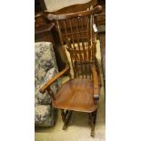 Two beech wood spindle back rocking armchairs, width 56cm, depth 55cm, height 128cm