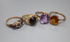 Four assorted early 20th century and later 9ct and gem set dress rings, gross 11.7 grams.