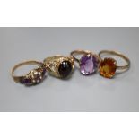 Four assorted early 20th century and later 9ct and gem set dress rings, gross 11.7 grams.