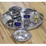 A large oval plated galleried tray and a collection of plated items, including an entree dish and