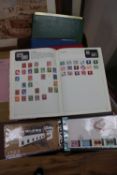 A collection of world stamps and first day covers