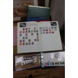 A collection of world stamps and first day covers