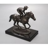 David Cornell, 1985. A cast bronze racehorse and jockey, entitled 'Champion Finish', on slate