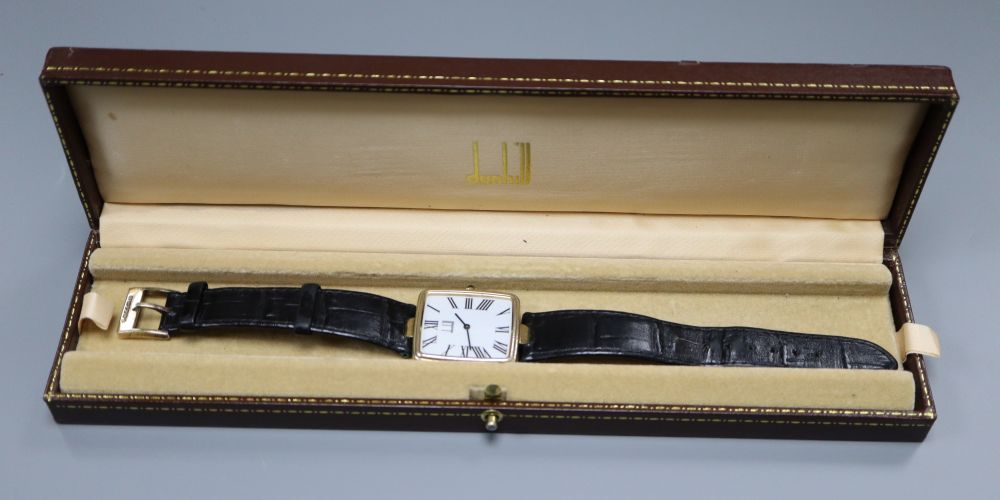 A gentleman's stylish modern silver gilt Dunhill quartz wrist watch, with rectangular Roman dial, on