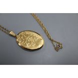 A modern 9ct gold oval locket, on a 9ct chain, locket 32mm, gross 11.4 grams.