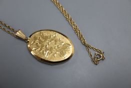 A modern 9ct gold oval locket, on a 9ct chain, locket 32mm, gross 11.4 grams.