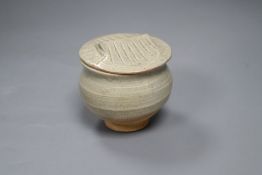 A Chinese Song/Yuan Dynasty Qingbai small jar with 'tiled roof' cover, height 8.5cm