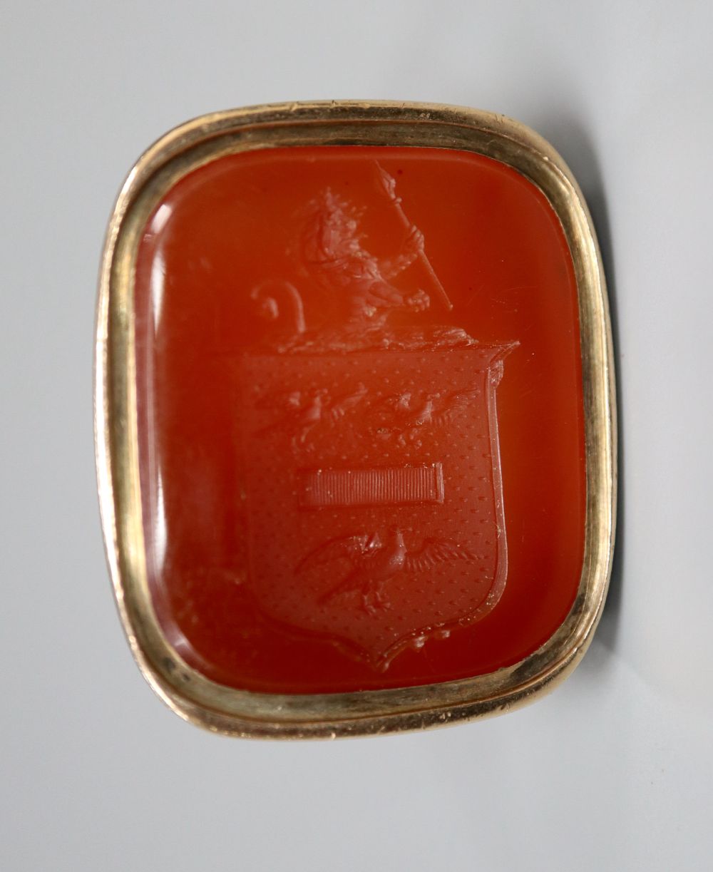 A 19th century gold (tests as 14ct) fob seal with intaglio-cut carnelian matrix, 30mm, gross 15.9