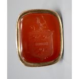 A 19th century gold (tests as 14ct) fob seal with intaglio-cut carnelian matrix, 30mm, gross 15.9