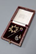 An early 20th century 15ct and gem set pendant, 30mm, gross 3.3 grams, a gem set twin hearts stick