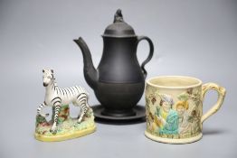 A 19th century Staffordshire pottery model of a zebra, a Victorian relief-moulded frog mug, a