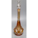 A tall amber-flashed glass decanter and clear stopper, height 48cm