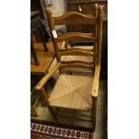 A set of eight ladder back rush seat dining chairs