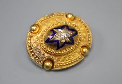 A Victorian yellow metal, blue enamel and diamond set oval mourning brooch, verso with hair below