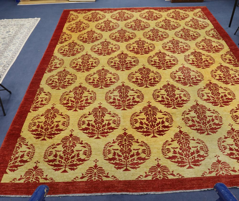 A large Turkish Zeigler style gold ground, red patterned carpet, 500 x 368cm