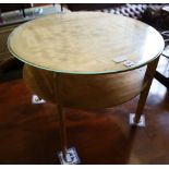 A 1950's satin maple circular occasional table, 64cm diameter, 52cm high