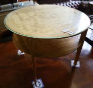 A 1950's satin maple circular occasional table, 64cm diameter, 52cm high