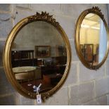 A pair of Victorian gilt oval wall mirrors, 58 x 72cm