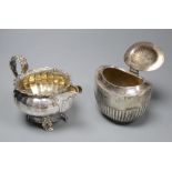A George IV silver cream jug, London 1823 and an oval half-fluted tea caddy, William Hutton & Sons