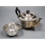 A George V silver teapot and matching sugar bowl, gross 13oz.CONDITION: Two very large dents to