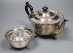 A George V silver teapot and matching sugar bowl, gross 13oz.CONDITION: Two very large dents to