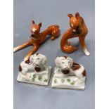 A pair of Goebel ceramic Doberman's, tallest 7.5cm and a pair of miniature Continental Spaniels, 5cm