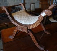 An early 20th century Anglo Burmese teak X frame stool, width 74cmCONDITION: A little dusty but