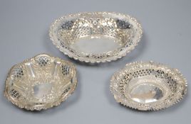 A late Victorian repousse silver bon bon dish and two similar Edwardian dishes, largest 16.8cm,