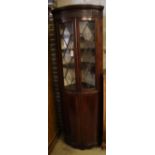 An Edwardian mahogany and boxwood-strung bow-fronted glazed corner cabinet, width 68cm depth 45cm