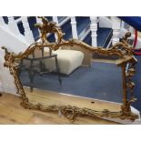 A gilt frame cartouche shaped wall mirror, width 112cm height 98cmCONDITION: A little dusty and