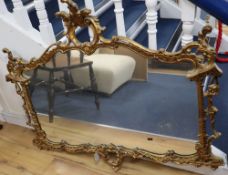 A gilt frame cartouche shaped wall mirror, width 112cm height 98cmCONDITION: A little dusty and