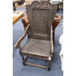 A Charles I oak panel back Wainscot chair, the central panel carved 'JOHN LUND 1636', some