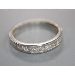 A modern platinum and channel set ten stone diamond half eternity ring, size N, gross 2.9 grams,