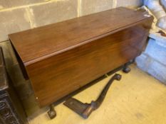 A George III mahogany drop-leaf dining table, with cabriole legs and claw and ball feet, length