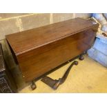 A George III mahogany drop-leaf dining table, with cabriole legs and claw and ball feet, length