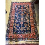 A Belouch blue ground rug, 172 x 110cmCONDITION: Some wear to the central field and also wear just