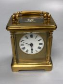 A late 19th century French brass carriage timepiece, 13cm high to handleCONDITION: The white