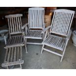 A pair of weathered teak folding garden chairs and a similar steamer chairCONDITION: All in