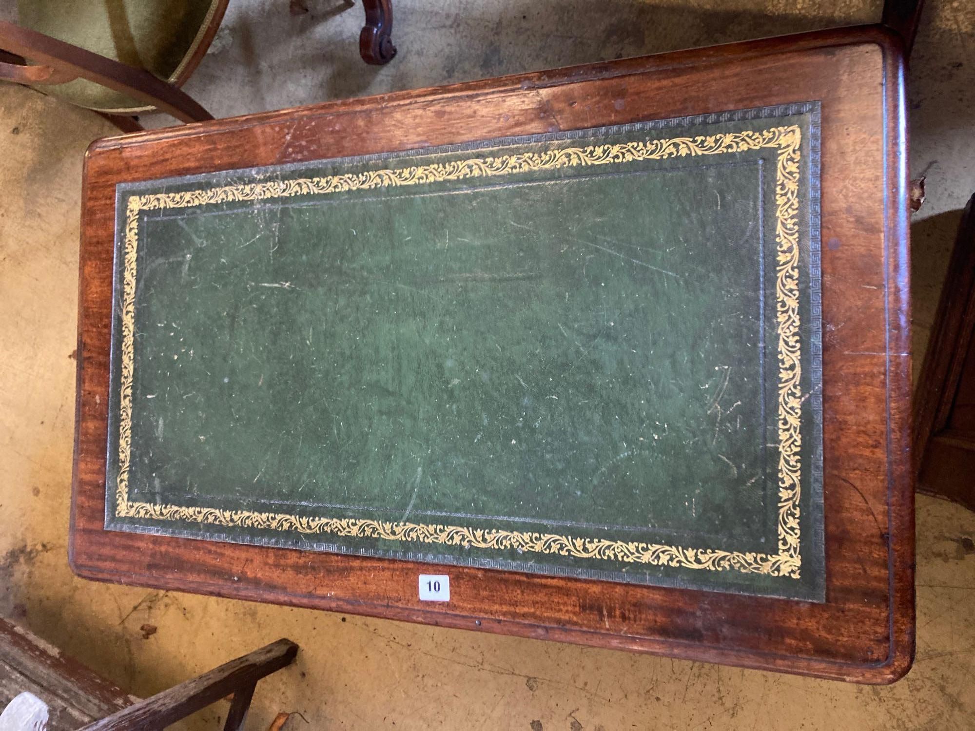 A late Victorian mahogany writing table, with leather lined top and ceramic castors, width - Image 2 of 4