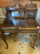 An early 20th century stained beech writing table, with raised superstructure, width 77cm height