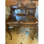 An early 20th century stained beech writing table, with raised superstructure, width 77cm height