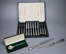 A cased set of 6 pairs of silver handled dessert knives & forks, a Peter Jackson Christmas spoon and